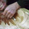Ingo carves out the inside of a bowl